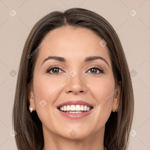 Joyful white young-adult female with long  brown hair and brown eyes