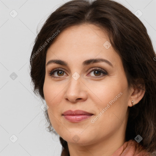 Joyful white young-adult female with long  brown hair and brown eyes