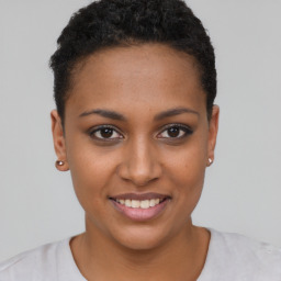 Joyful black young-adult female with short  brown hair and brown eyes