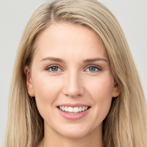 Joyful white young-adult female with long  brown hair and grey eyes