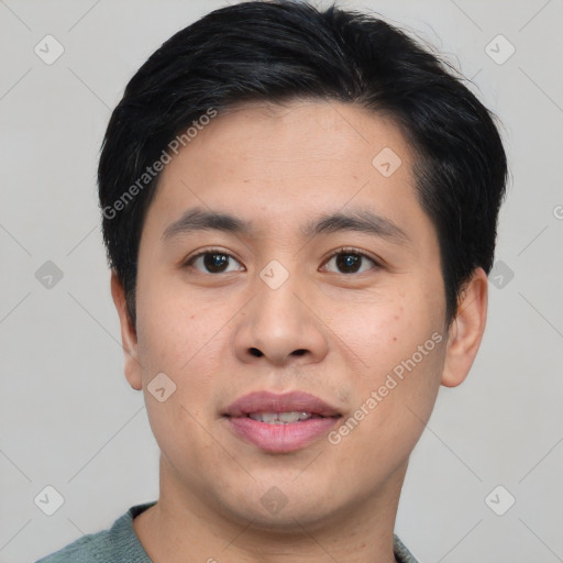 Joyful asian young-adult male with short  black hair and brown eyes