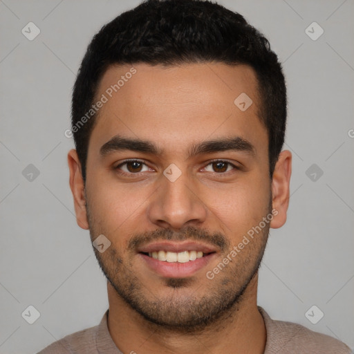 Joyful latino young-adult male with short  black hair and brown eyes