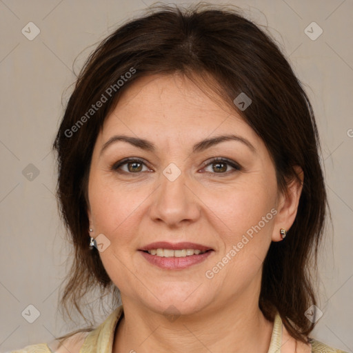 Joyful white adult female with medium  brown hair and brown eyes