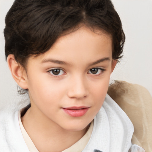 Joyful white child female with short  brown hair and brown eyes