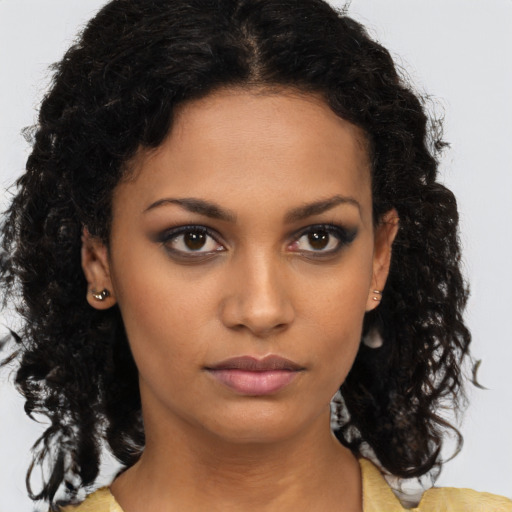 Neutral black young-adult female with medium  brown hair and brown eyes