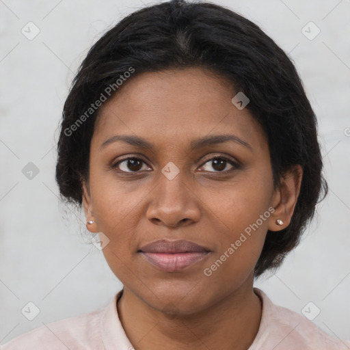 Joyful black adult female with short  brown hair and brown eyes