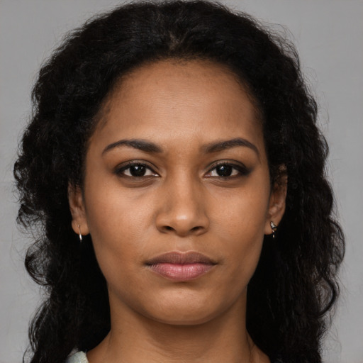 Neutral black young-adult female with long  brown hair and brown eyes