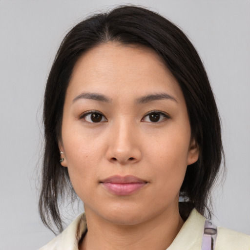 Neutral asian young-adult female with medium  brown hair and brown eyes