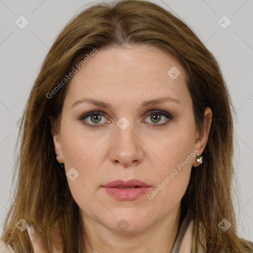 Joyful white adult female with long  brown hair and grey eyes