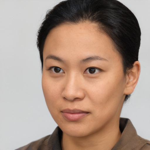 Neutral asian young-adult female with short  brown hair and brown eyes