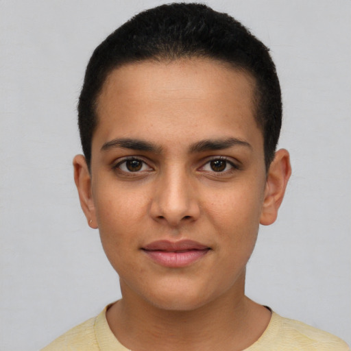 Joyful latino young-adult female with short  brown hair and brown eyes
