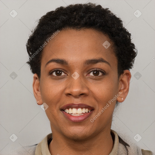 Joyful black young-adult female with short  brown hair and brown eyes