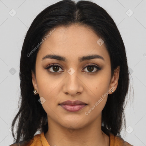 Joyful latino young-adult female with long  black hair and brown eyes