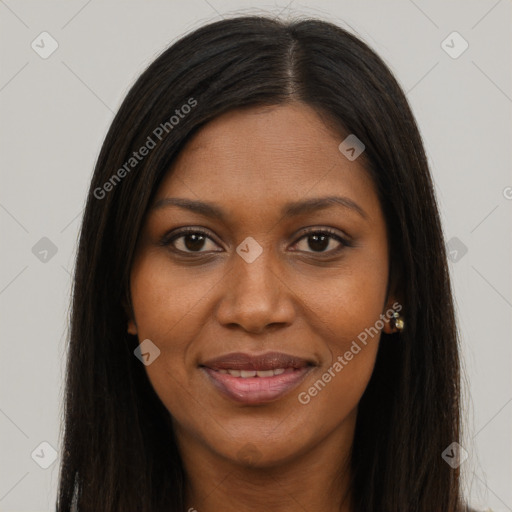 Joyful black young-adult female with long  brown hair and brown eyes