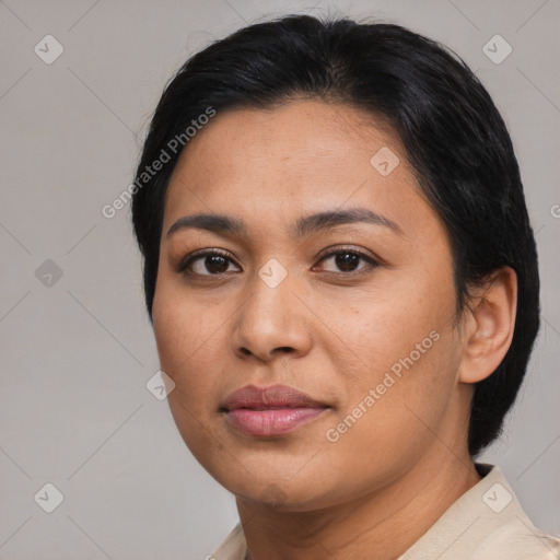 Joyful latino young-adult female with medium  brown hair and brown eyes