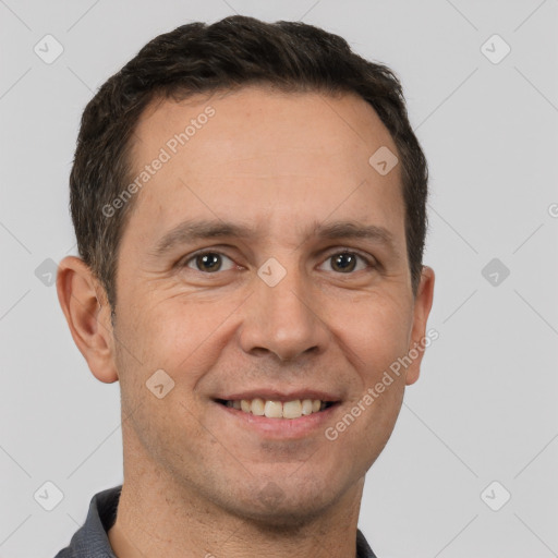 Joyful white adult male with short  brown hair and brown eyes