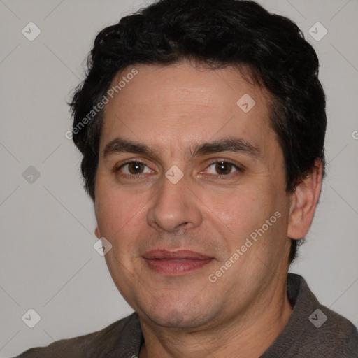 Joyful white adult male with short  black hair and brown eyes