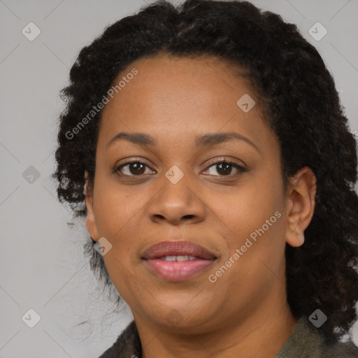 Joyful black adult female with medium  black hair and brown eyes