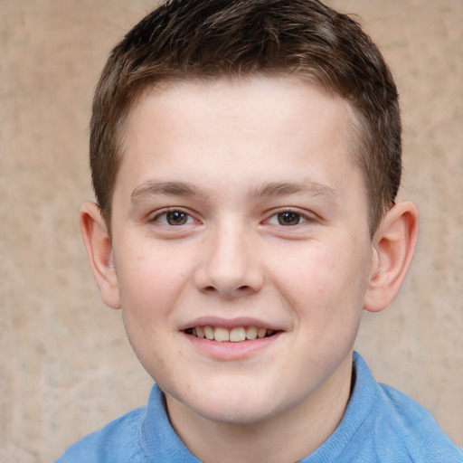 Joyful white child male with short  brown hair and brown eyes