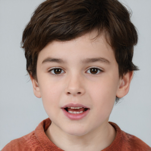 Joyful white child male with short  brown hair and brown eyes