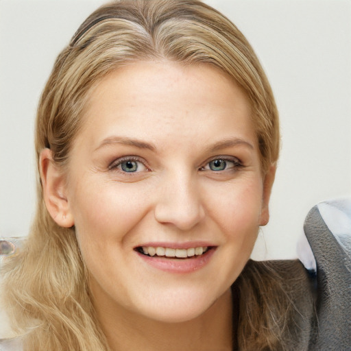 Joyful white young-adult female with long  brown hair and grey eyes