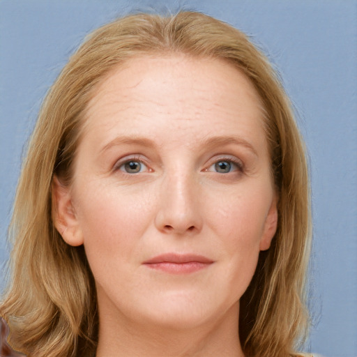 Joyful white young-adult female with long  brown hair and blue eyes