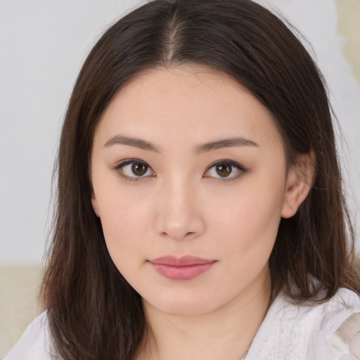 Neutral asian young-adult female with medium  brown hair and brown eyes