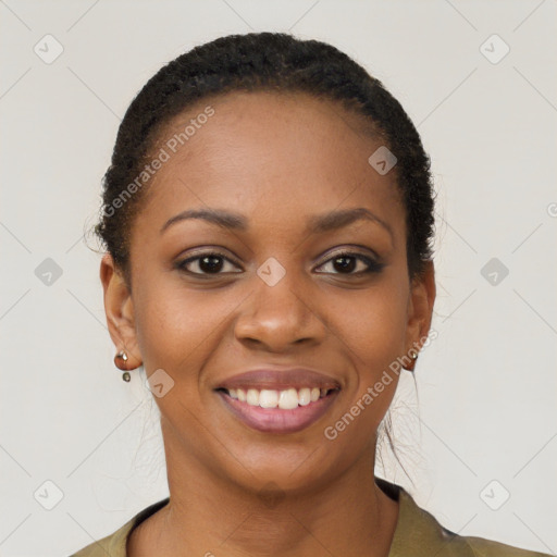 Joyful black young-adult female with short  brown hair and brown eyes