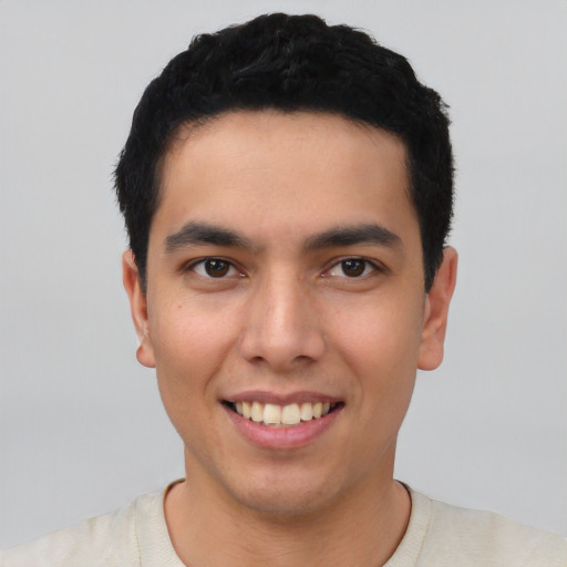 Joyful asian young-adult male with short  black hair and brown eyes