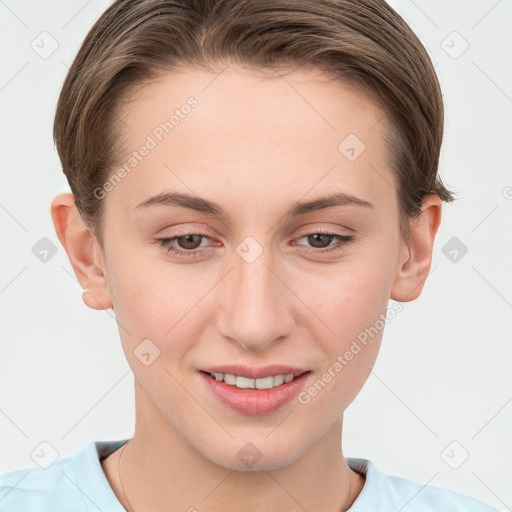 Joyful white young-adult female with short  brown hair and grey eyes