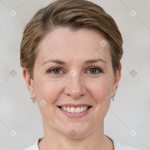 Joyful white adult female with short  brown hair and grey eyes