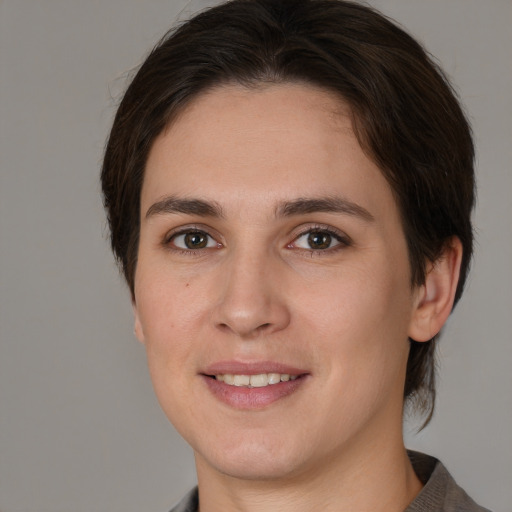 Joyful white young-adult female with medium  brown hair and brown eyes