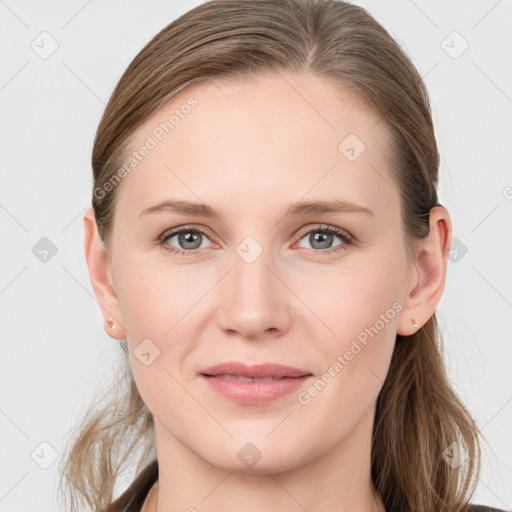 Joyful white young-adult female with medium  brown hair and blue eyes