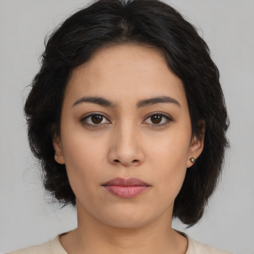 Neutral latino young-adult female with long  brown hair and brown eyes
