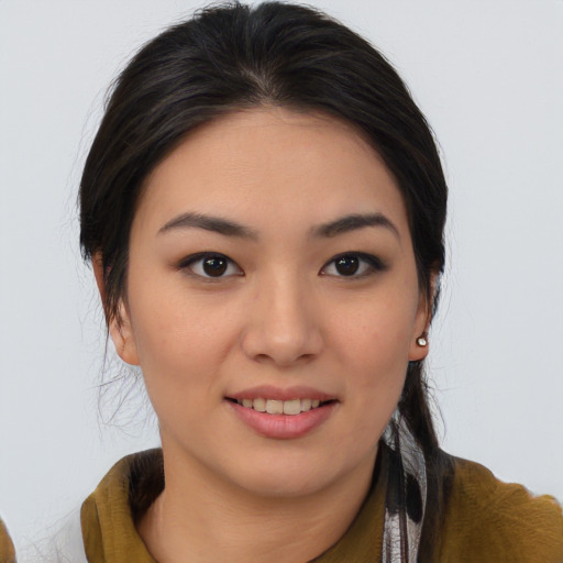 Joyful asian young-adult female with medium  brown hair and brown eyes