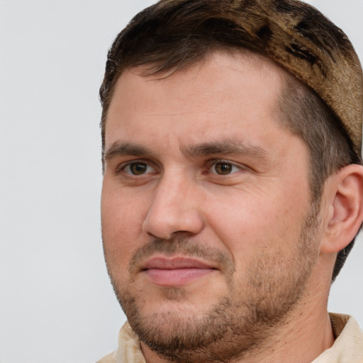 Joyful white adult male with short  brown hair and brown eyes