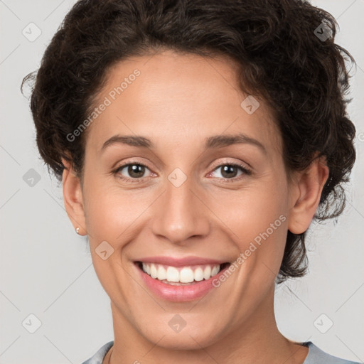 Joyful white young-adult female with short  brown hair and brown eyes