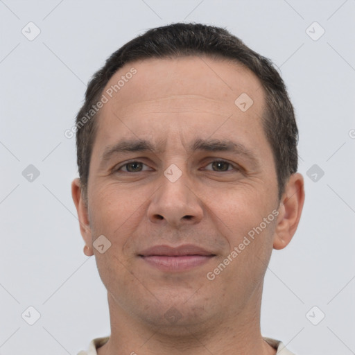 Joyful white adult male with short  brown hair and brown eyes