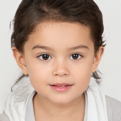 Joyful white child female with medium  brown hair and brown eyes