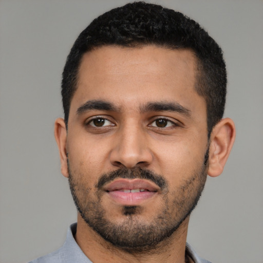 Neutral latino young-adult male with short  black hair and brown eyes