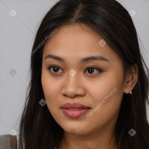 Joyful asian young-adult female with long  brown hair and brown eyes