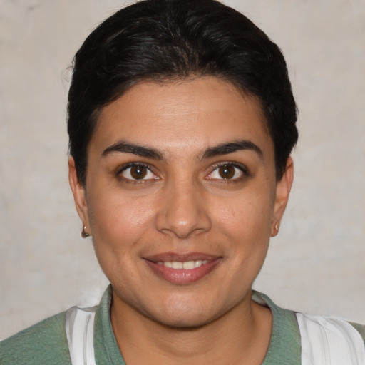 Joyful white young-adult female with short  brown hair and brown eyes