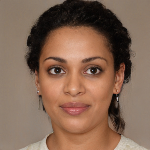 Joyful latino young-adult female with short  brown hair and brown eyes