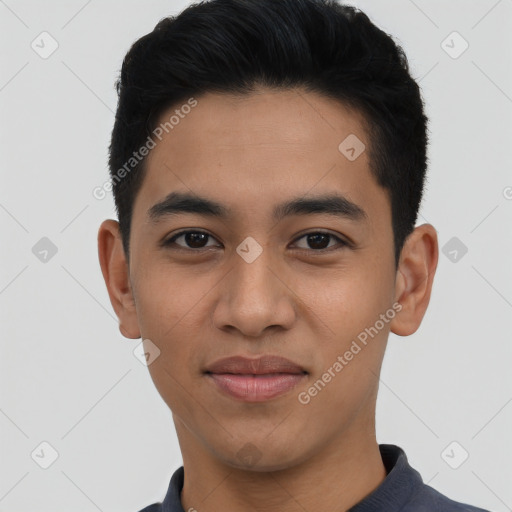 Joyful latino young-adult male with short  black hair and brown eyes