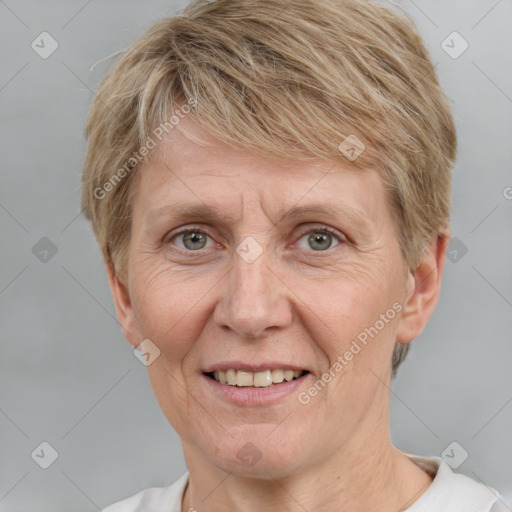 Joyful white adult female with short  brown hair and grey eyes