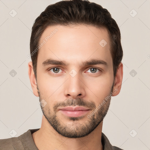 Joyful white young-adult male with short  brown hair and brown eyes