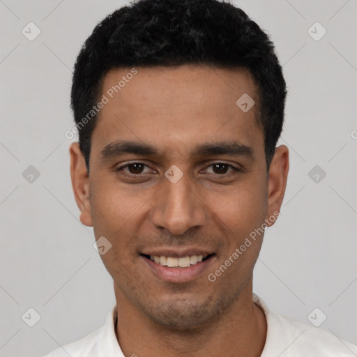 Joyful latino young-adult male with short  black hair and brown eyes