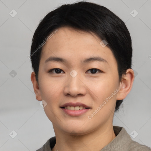 Joyful asian young-adult female with short  black hair and brown eyes