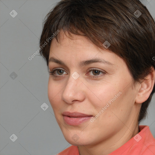 Joyful white young-adult female with short  brown hair and brown eyes