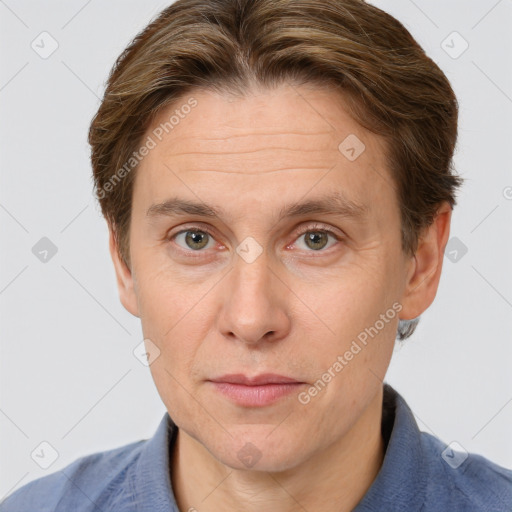 Joyful white adult male with short  brown hair and grey eyes